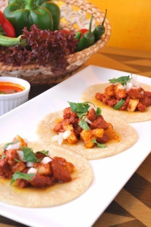 Pork taco in “al pastor” style seasoned with achiote and mild Mexican spices